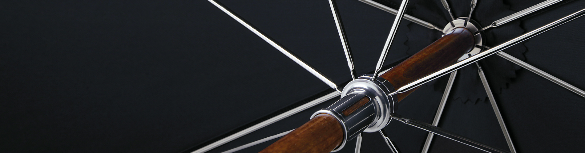 Detail view of a frame from a Brillant luxury umbrella with wooden shaft