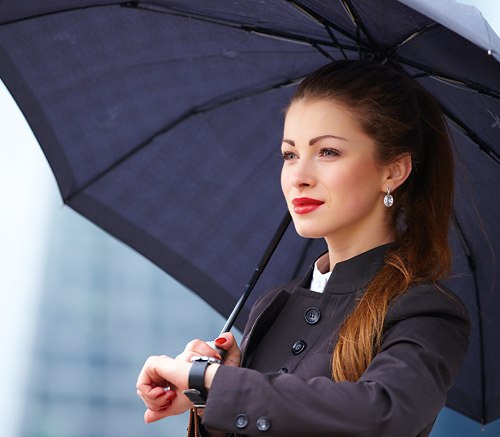 View of an opened city umbrella in navy blue in use